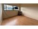 Bedroom features hardwood floors, natural light, and a neutral color scheme for a serene atmosphere at 6615 Beamer Way, Orlando, FL 32807