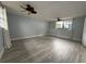 Large bedroom with stylish tile flooring, recessed lighting, and ceiling fans at 6615 Beamer Way, Orlando, FL 32807