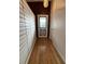 Inviting entryway featuring hardwood floors and decorative glass front door at 6615 Beamer Way, Orlando, FL 32807