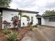Charming single-story home featuring a well-maintained yard, mature landscaping and a concrete driveway at 6615 Beamer Way, Orlando, FL 32807