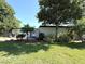 Inviting single-story home with a well-kept lawn, landscaping, and a spacious driveway leading to the entrance at 6615 Beamer Way, Orlando, FL 32807