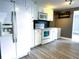 Bright kitchen with white cabinets, modern appliances, and a stylish backsplash at 6615 Beamer Way, Orlando, FL 32807