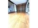Bright Living room with hardwood floors, built in shelving, and light streaming in at 6615 Beamer Way, Orlando, FL 32807
