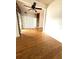Spacious living room featuring hardwood floors and bright light from nearby window at 6615 Beamer Way, Orlando, FL 32807
