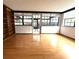 Bright sunroom boasting hardwood floors and built-in shelving, perfect for relaxation and entertainment at 6615 Beamer Way, Orlando, FL 32807
