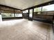 Tiled sunroom that contains dark trim windows and tile floors, offering a bright and airy space at 6615 Beamer Way, Orlando, FL 32807