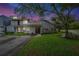 Charming townhome with a well-manicured lawn and inviting curb appeal enhanced by lovely landscaping at 701 Saint Michael Ln, Altamonte Springs, FL 32714