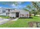 Charming townhome with a well-manicured lawn and inviting curb appeal enhanced by lovely landscaping at 701 Saint Michael Ln, Altamonte Springs, FL 32714