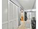 Inviting hallway features neutral tones, tile flooring, and ample closet space, creating a seamless flow at 701 Saint Michael Ln, Altamonte Springs, FL 32714