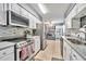 Modern kitchen featuring stainless steel appliances and white cabinets for a clean look at 701 Saint Michael Ln, Altamonte Springs, FL 32714
