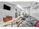 Spacious living room with vaulted ceilings, a comfortable sectional sofa, and stylish decor at 701 Saint Michael Ln, Altamonte Springs, FL 32714