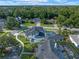 An aerial view of a luxurious home surrounded by lush greenery and a sparkling blue pool at 734 Terra Pl, Maitland, FL 32751