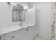 Bathroom features a modern vanity with ample cabinet space, neutral walls, and a stunning arched mirror at 734 Terra Pl, Maitland, FL 32751