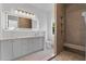 Beautiful bathroom with double vanity, a large mirror, and a walk-in shower at 734 Terra Pl, Maitland, FL 32751