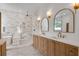 Elegant bathroom with a soaking tub, walk-in shower, dual vanity, and designer finishes at 734 Terra Pl, Maitland, FL 32751