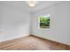 Bright bedroom with white walls, hardwood floors, and window at 734 Terra Pl, Maitland, FL 32751