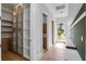 Bright hallway with custom built-ins and ample storage leads to the home's entryway at 734 Terra Pl, Maitland, FL 32751