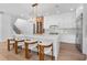 Bright kitchen boasts a large waterfall island with seating, stainless steel appliances, and custom cabinets at 734 Terra Pl, Maitland, FL 32751