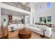Open-concept living room showcasing high ceilings, a modern kitchen, and elegant dining area with natural light at 734 Terra Pl, Maitland, FL 32751