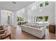 Spacious living room with high ceilings, modern lighting, and seamless access to the outdoor pool area at 734 Terra Pl, Maitland, FL 32751