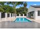 Backyard features a black and white fence surrounding a sparkling swimming pool and landscaped yard at 734 Terra Pl, Maitland, FL 32751