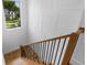 Staircase with wood treads and metal railings, with a view of the outdoors from a nearby window at 734 Terra Pl, Maitland, FL 32751