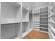 Spacious walk-in closet with custom shelving, drawers, and ample storage, providing organized luxury at 734 Terra Pl, Maitland, FL 32751