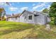 Home backyard with a well-maintained lawn and privacy fence at 737 Tanglewood Rd, Winter Springs, FL 32708