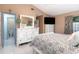 Bedroom featuring neutral paint, white furniture, vaulted ceiling, and ensuite bathroom at 737 Tanglewood Rd, Winter Springs, FL 32708