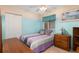 Cozy bedroom featuring dual-tone walls, tile flooring, and a window view at 737 Tanglewood Rd, Winter Springs, FL 32708