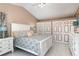 Bedroom featuring neutral paint, vaulted ceiling, tile flooring, and closet doors at 737 Tanglewood Rd, Winter Springs, FL 32708