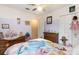 Charming bedroom with pastel paint, ceiling fan, tile flooring, and traditional furniture at 737 Tanglewood Rd, Winter Springs, FL 32708