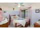 Bedroom featuring pastel paint, tile flooring, and a ceiling fan at 737 Tanglewood Rd, Winter Springs, FL 32708