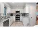 This bright kitchen includes stainless steel appliances and ample counter space at 737 Tanglewood Rd, Winter Springs, FL 32708