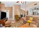 Spacious living room with a comfortable seating arrangement and seamless access to the dining area and kitchen at 737 Tanglewood Rd, Winter Springs, FL 32708