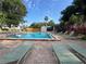 Outdoor pool with clear blue water, surrounded by lounge chairs on a sunny day, offering a relaxing retreat at 737 Tanglewood Rd, Winter Springs, FL 32708