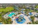 Aerial view of the waterpark featuring multiple slides, swimming pools, and a splash pad at 7647 Fairfax Dr, Kissimmee, FL 34747