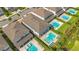 An aerial view shows the backyard pools and spas of neighboring homes at 7647 Fairfax Dr, Kissimmee, FL 34747