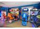 Arcade room with various racing games and other arcade machines for entertainment at 7647 Fairfax Dr, Kissimmee, FL 34747