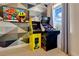 Fun arcade games with a geometric patterned wall and a window to view outside at 7647 Fairfax Dr, Kissimmee, FL 34747