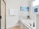 Bathroom with a relaxing soaking tub, elegant fixtures, and a separate shower with a glass door at 7647 Fairfax Dr, Kissimmee, FL 34747