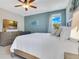 Inviting bedroom with a king-sized bed, stylish furnishings, and relaxing ambiance at 7647 Fairfax Dr, Kissimmee, FL 34747
