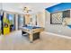 Spacious game room featuring a pool table, wet bar, and arcade game at 7647 Fairfax Dr, Kissimmee, FL 34747