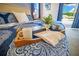 Bed setting with luxury chalets book and coffee mug set up on a blue and white patterned bedspread at 7647 Fairfax Dr, Kissimmee, FL 34747