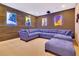 Home movie room featuring a comfortable sectional couch and a large flat screen TV at 7647 Fairfax Dr, Kissimmee, FL 34747