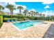 Refreshing backyard pool and spa surrounded by manicured landscaping, ideal for recreation at 7647 Fairfax Dr, Kissimmee, FL 34747