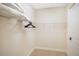 A walk-in closet with shelving and hanging storage, providing ample space for organizing clothes and accessories at 7647 Fairfax Dr, Kissimmee, FL 34747