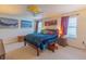 Cozy bedroom showcasing a queen bed, ceiling fan, and two windows at 87 Delacorte Way, Oviedo, FL 32765