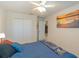 The comfortable bedroom features a double closet, carpeted floors, and ceiling fan at 87 Delacorte Way, Oviedo, FL 32765