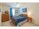 The comfortable bedroom features a wood framed bed and carpeted floors at 87 Delacorte Way, Oviedo, FL 32765